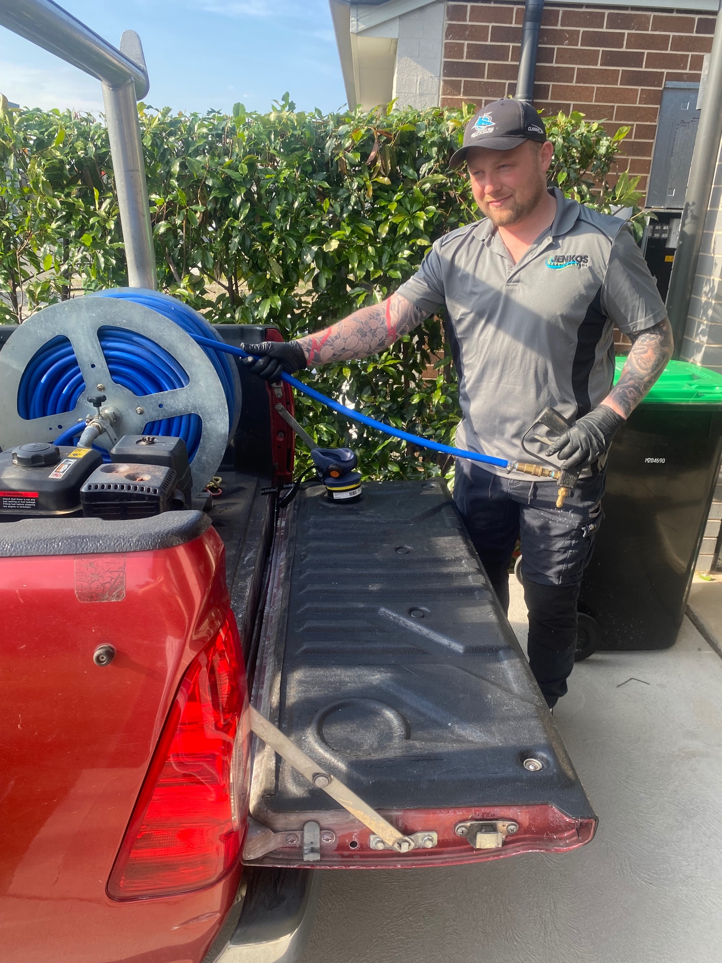Jenkos Pest Control technician preparing spray equipment at a Sydney home